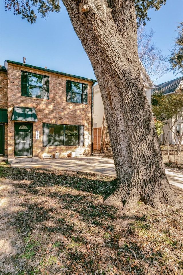 rear view of house featuring a patio