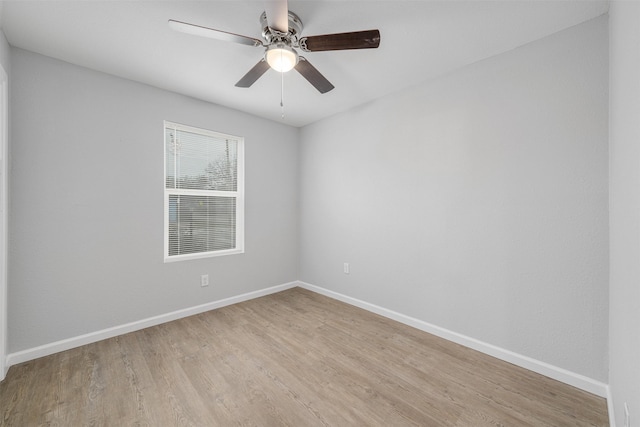 spare room featuring ceiling fan and light wood-type flooring