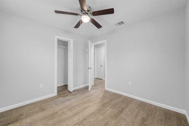 unfurnished bedroom featuring ceiling fan and light hardwood / wood-style flooring