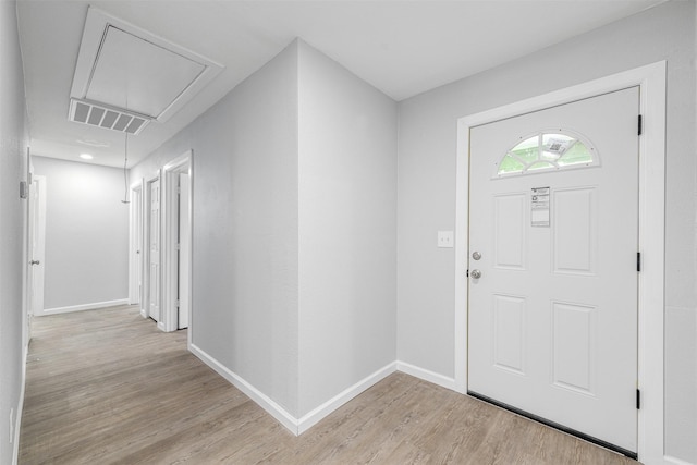 foyer with light hardwood / wood-style floors