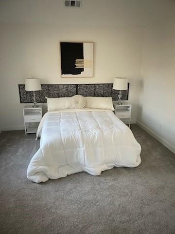 bedroom featuring dark colored carpet