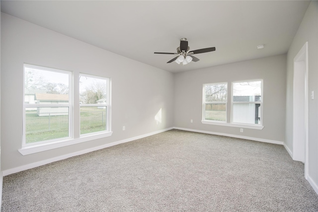 unfurnished room featuring carpet and ceiling fan