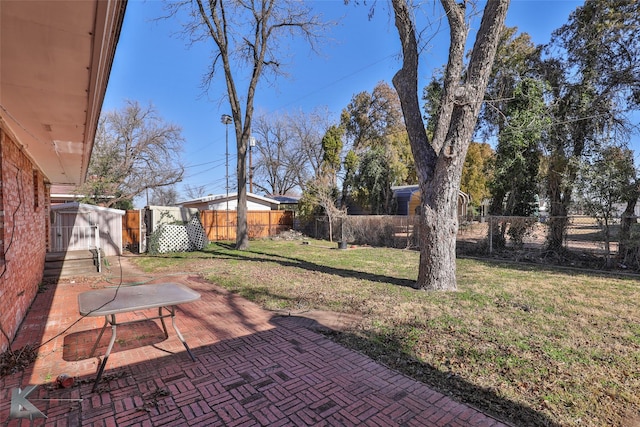 120 N 15th Ave, Munday, TX 76371 - view of yard with a patio area and a storage unit