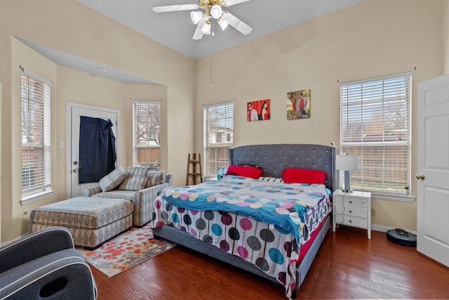 bedroom with dark wood-type flooring and ceiling fan