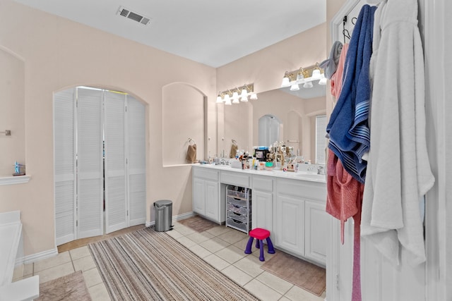 bathroom with vanity and tile patterned floors