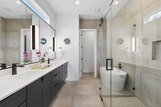 bathroom featuring vanity and separate shower and tub