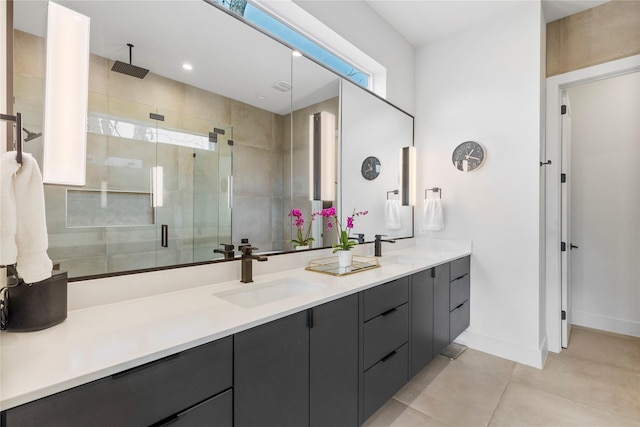 bathroom featuring vanity, an enclosed shower, and tile patterned floors