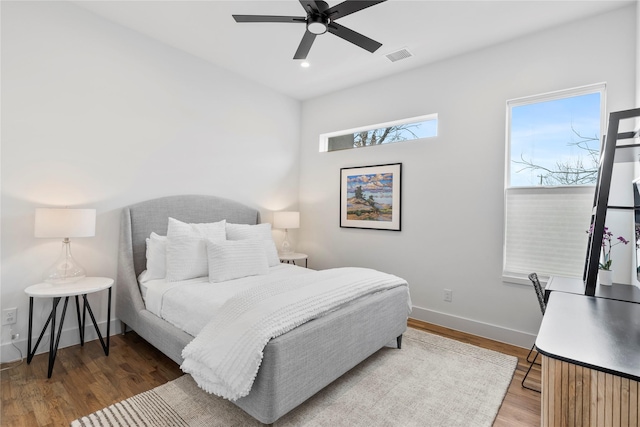 bedroom featuring dark wood-type flooring and ceiling fan