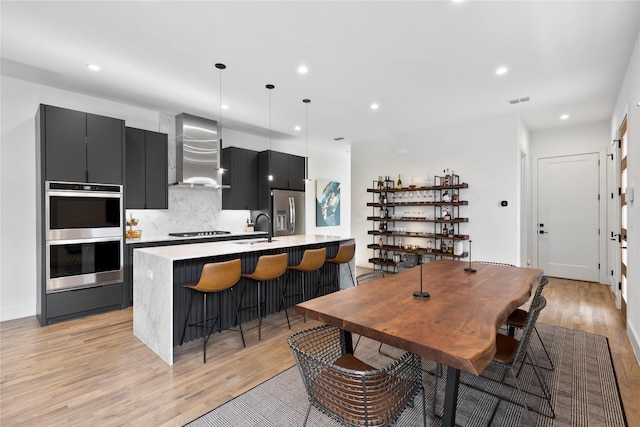 interior space with sink and light hardwood / wood-style floors