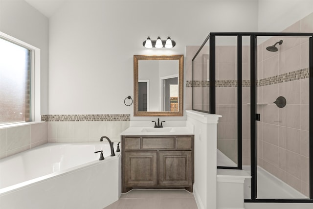 bathroom featuring tile patterned flooring, vanity, and independent shower and bath