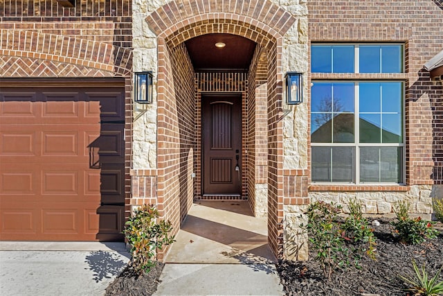 entrance to property featuring a garage