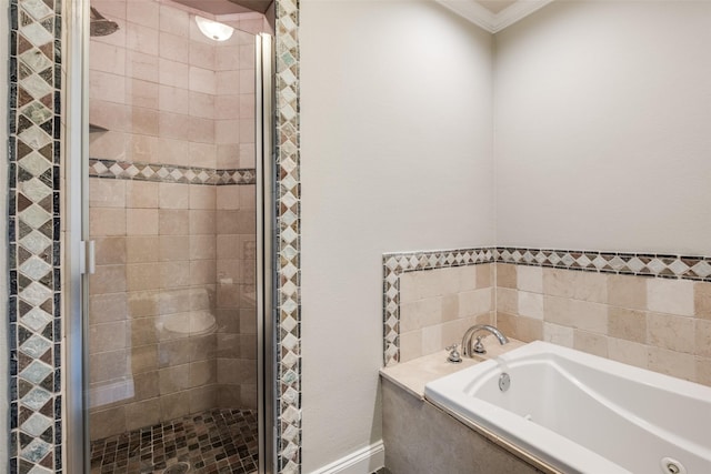 bathroom with crown molding and separate shower and tub