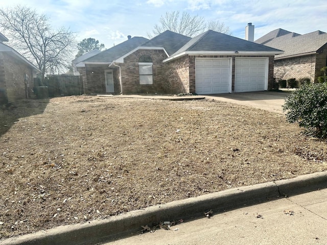 ranch-style house featuring a garage