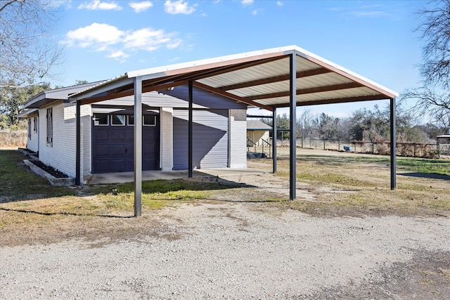 view of vehicle parking with a garage and a carport