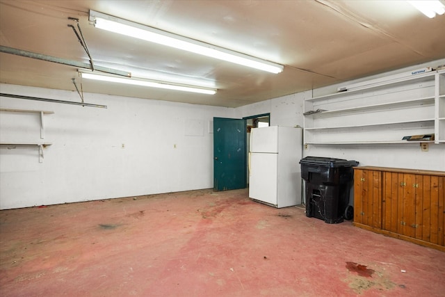 garage with white fridge