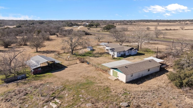 birds eye view of property featuring a rural view