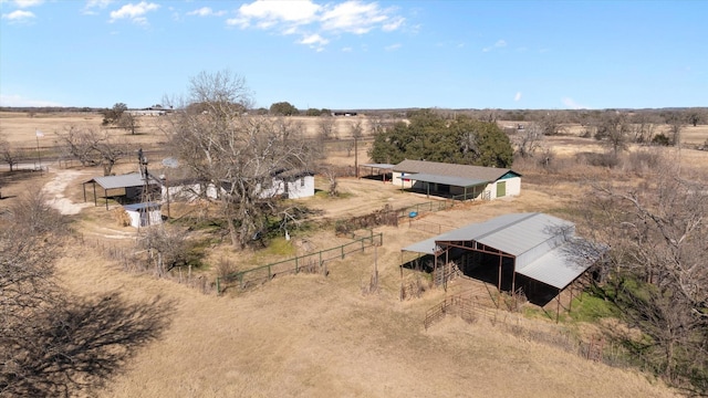 birds eye view of property featuring a rural view