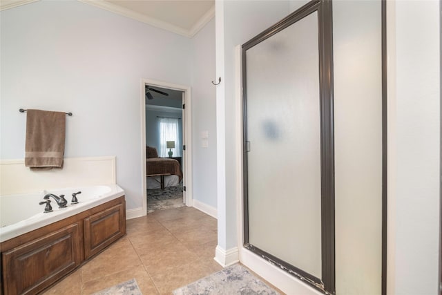 bathroom featuring crown molding, tile patterned floors, and separate shower and tub