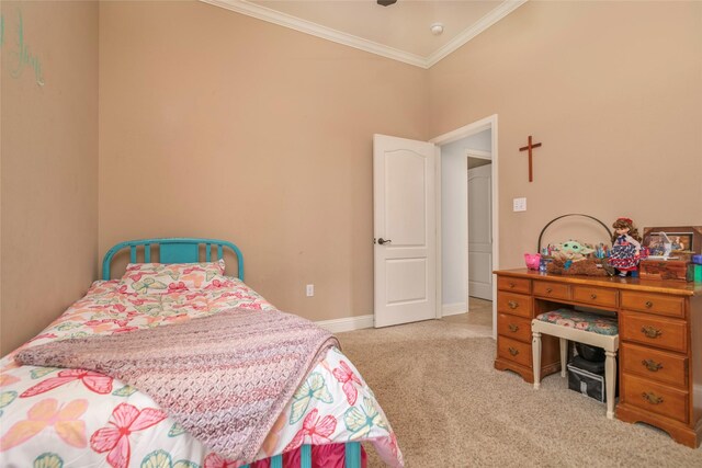 carpeted bedroom with ornamental molding