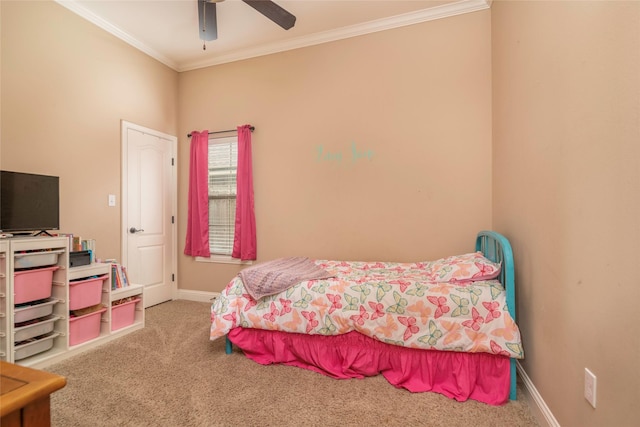 bedroom featuring ornamental molding, ceiling fan, and carpet