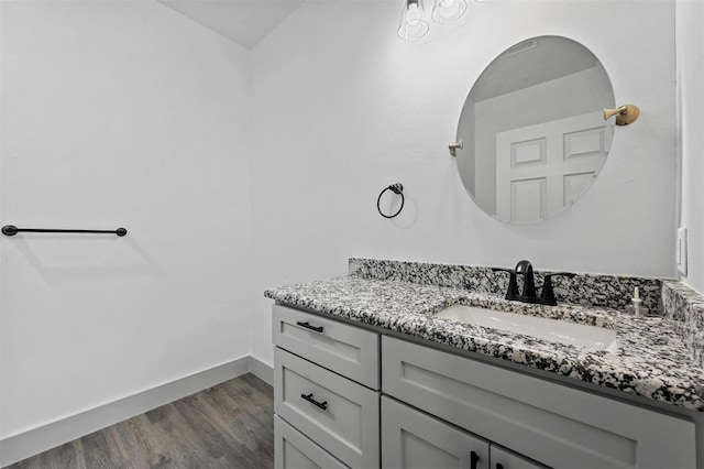 bathroom featuring hardwood / wood-style flooring and vanity