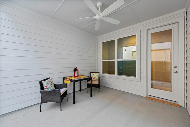 view of patio / terrace with a fire pit and ceiling fan