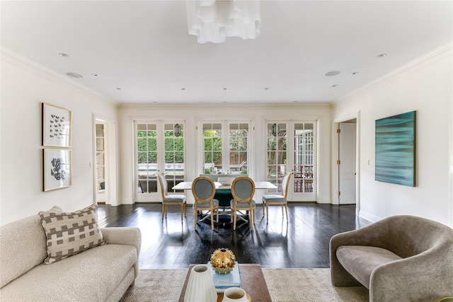 living room with dark hardwood / wood-style flooring, crown molding, plenty of natural light, and french doors