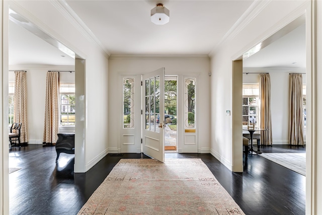 doorway with ornamental molding and dark hardwood / wood-style floors