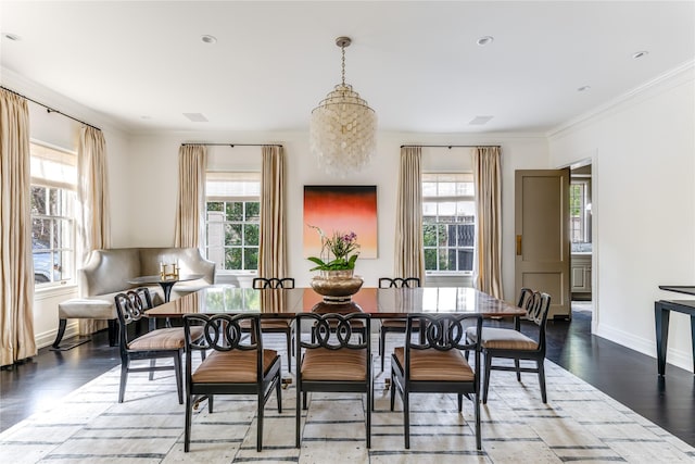 dining space with crown molding and dark hardwood / wood-style floors