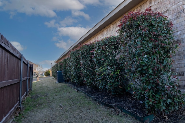 view of yard with central AC unit