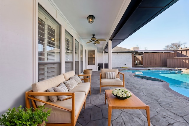 view of patio / terrace featuring ceiling fan, an outdoor living space, and a fenced in pool