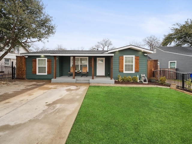 single story home with covered porch and a front lawn