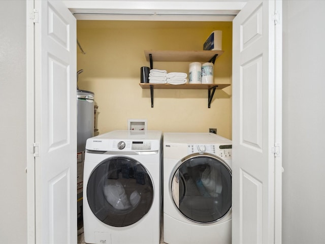 clothes washing area with washing machine and clothes dryer