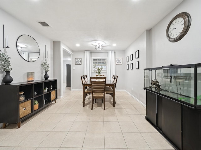 dining area with light tile patterned floors