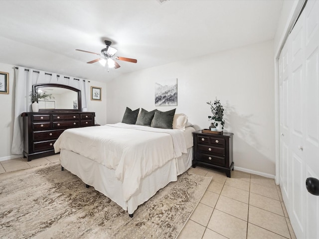 tiled bedroom featuring a closet and ceiling fan