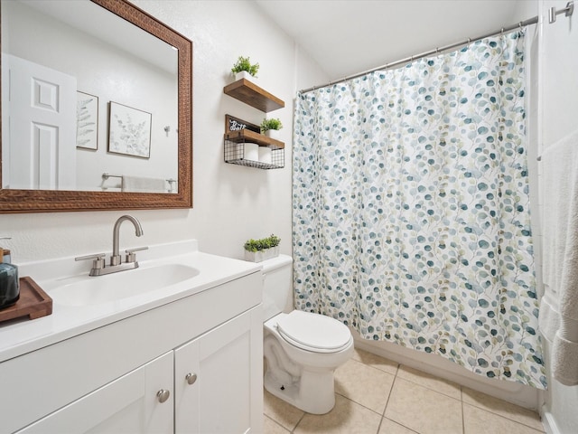 bathroom with tile patterned floors, vanity, and toilet