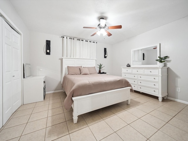 tiled bedroom featuring a closet and ceiling fan