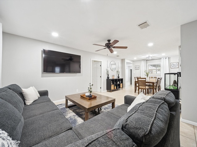 tiled living room with ceiling fan