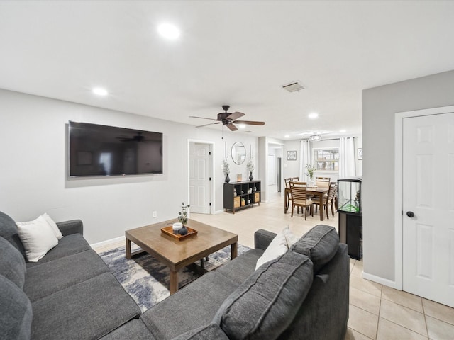 tiled living room with ceiling fan