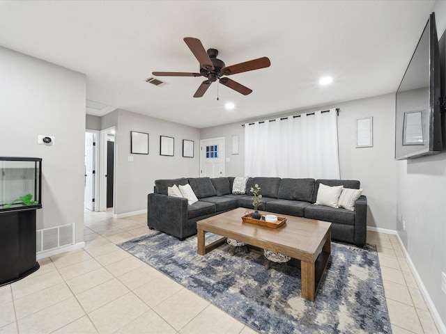 living room with ceiling fan and light tile patterned floors