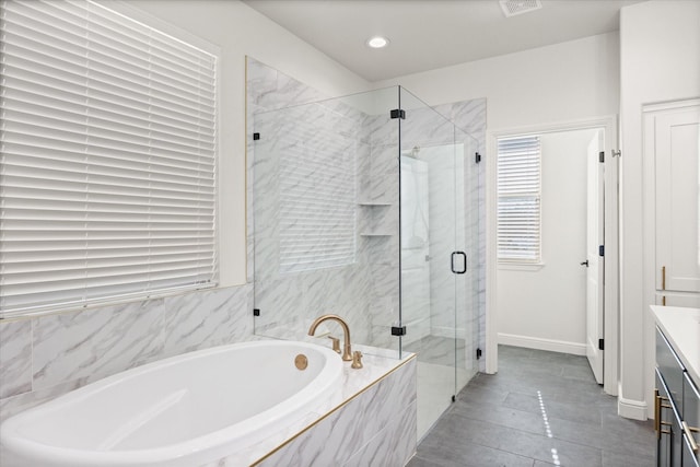 bathroom with vanity, separate shower and tub, and tile patterned flooring