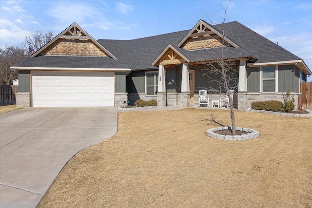 craftsman inspired home with a garage and a front yard