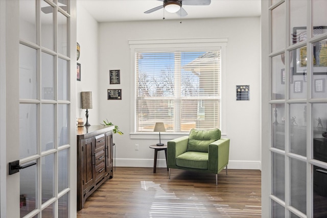 living area featuring hardwood / wood-style flooring, plenty of natural light, and french doors