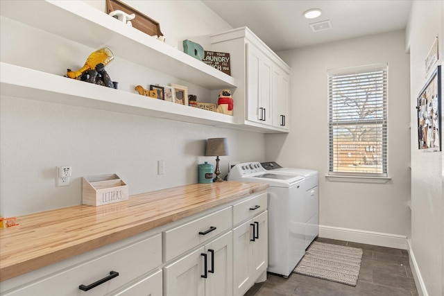 laundry room with cabinets and independent washer and dryer