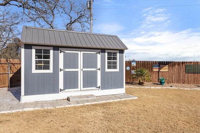 view of outbuilding featuring a lawn