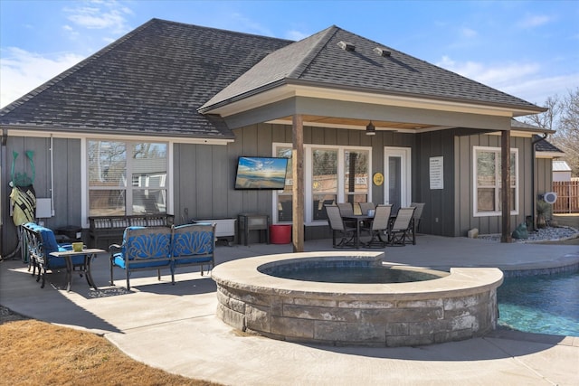 back of house featuring a swimming pool with hot tub, an outdoor hangout area, ceiling fan, and a patio area