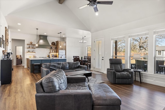 living room featuring ceiling fan with notable chandelier, high vaulted ceiling, dark hardwood / wood-style floors, and beamed ceiling