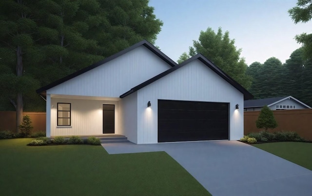 view of front of home featuring a garage and a lawn