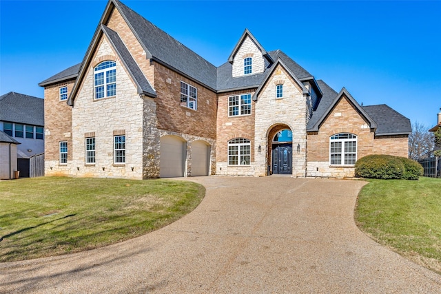 view of front of home featuring a garage and a front lawn