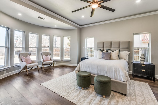 bedroom with multiple windows, ornamental molding, dark wood-type flooring, and ceiling fan